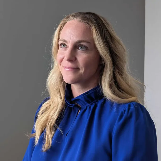 "Headshot of Caitlyn Collins, associate professor of sociology at Washington University."